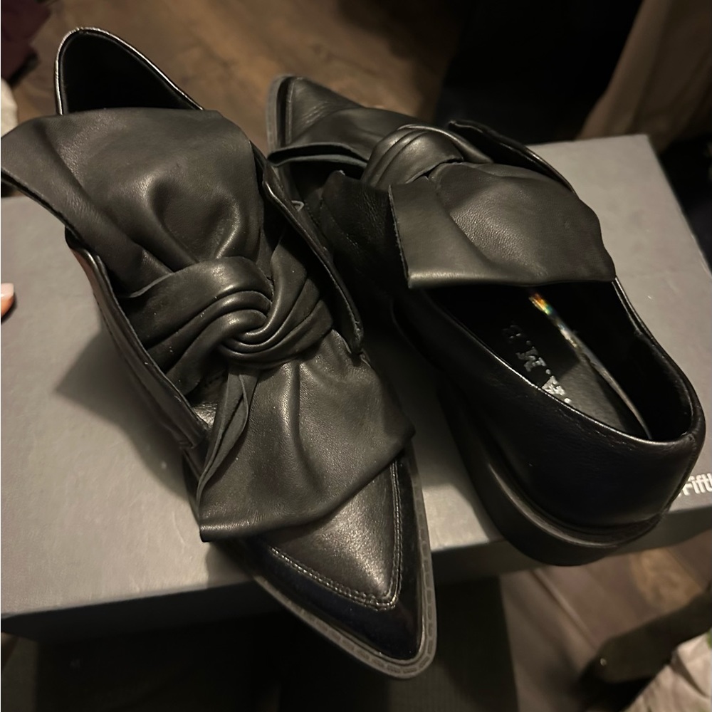 Leather women shoes with large front bow. New. Never worn. Without origin box.